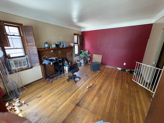 14151 Bringard Dr, Detroit, MI 48205 - office space featuring hardwood / wood-style flooring, a brick fireplace, and cooling unit