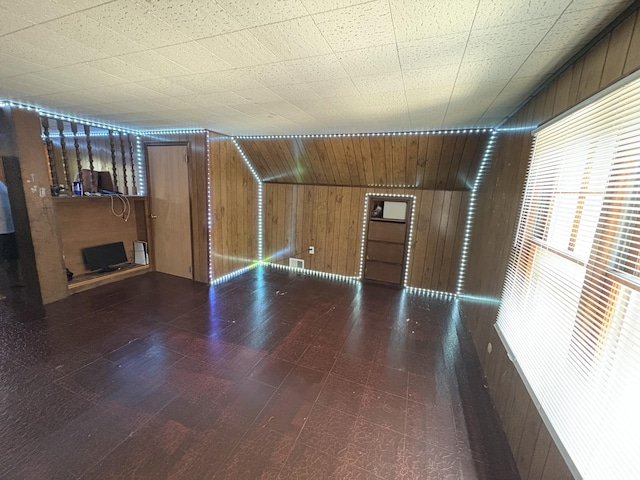 14151 Bringard Dr, Detroit, MI 48205 - unfurnished living room featuring wooden walls, tile patterned floors, and a fireplace