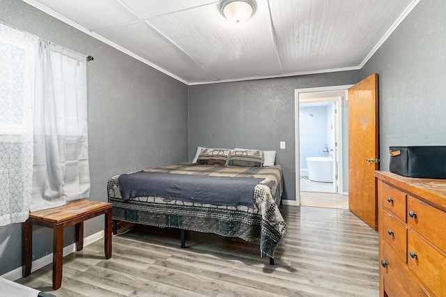 5468 S Custer Rd, Custer, MI 49405 - bedroom featuring a textured wall, crown molding, and wood finished floors