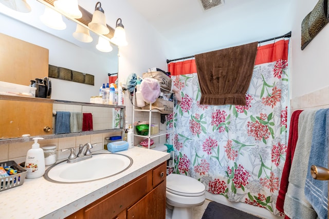 8741 Meadow Ln, Berrien Springs, MI 49103 - bathroom with vanity, tasteful backsplash, curtained shower, and tile walls