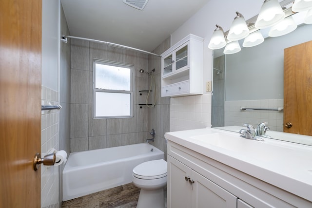 8741 Meadow Ln, Berrien Springs, MI 49103 - bathroom featuring tile walls, shower / bath combination, vanity, and wood finished floors