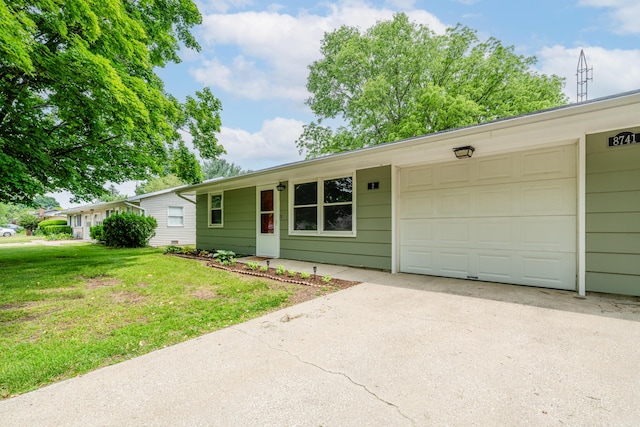 8741 Meadow Ln, Berrien Springs, MI 49103 - single story home with concrete driveway, a front yard, and a garage