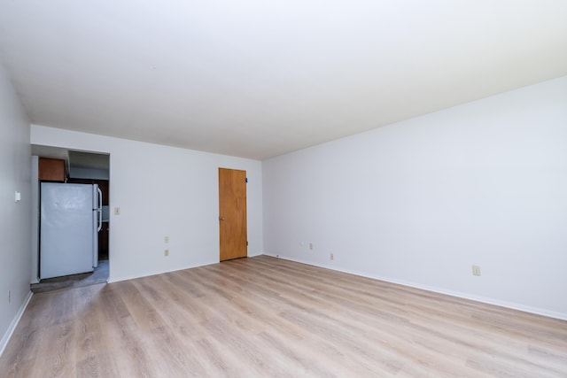 8741 Meadow Ln, Berrien Springs, MI 49103 - spare room with light wood finished floors and baseboards
