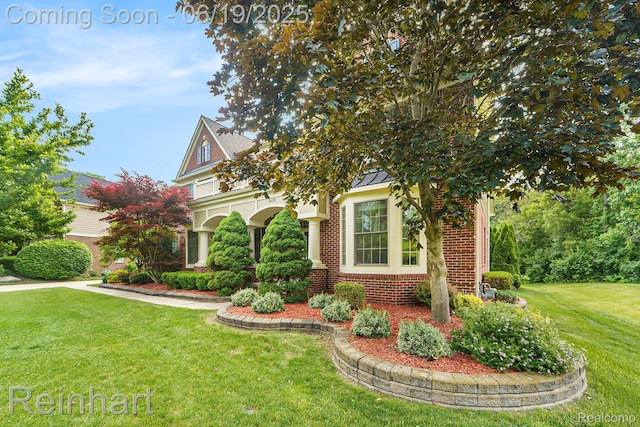 2032 Cameo Ct, Canton, MI 48187 - view of front of house with brick siding, a front lawn, and a standing seam roof