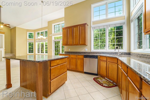 2032 Cameo Ct, Canton, MI 48187 - kitchen featuring dishwasher, light tile patterned flooring, a kitchen island, brown cabinetry, and decorative light fixtures