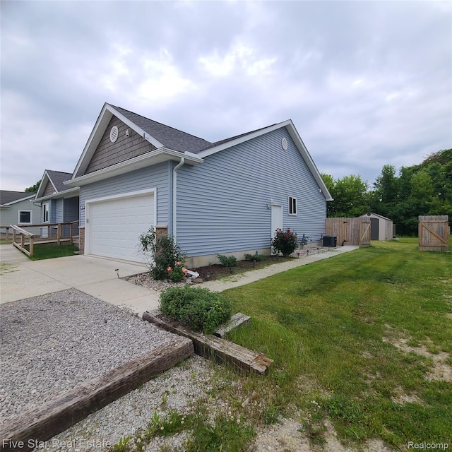 105 Degurse Ave, Marine City, MI 48039 - view of home's exterior with concrete driveway, a garage, and a shingled roof