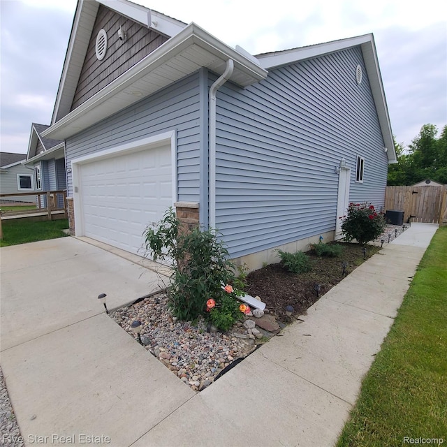 105 Degurse Ave, Marine City, MI 48039 - view of side of property featuring driveway and a garage