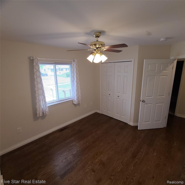 105 Degurse Ave, Marine City, MI 48039 - unfurnished bedroom featuring dark wood-style floors, a closet, and a ceiling fan
