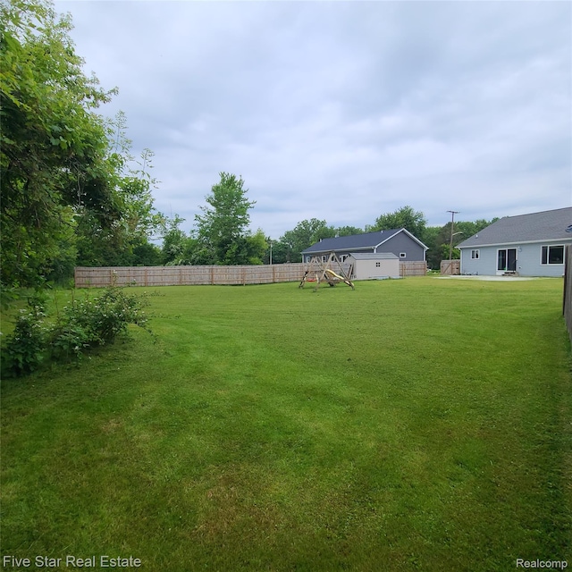 105 Degurse Ave, Marine City, MI 48039 - fenced backyard with a playground