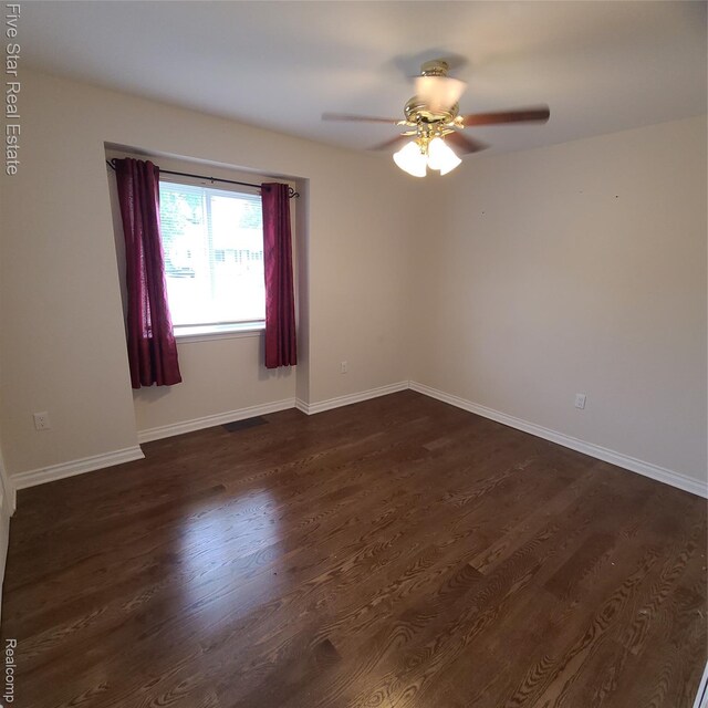 105 Degurse Ave, Marine City, MI 48039 - unfurnished room with dark wood-style flooring and a ceiling fan