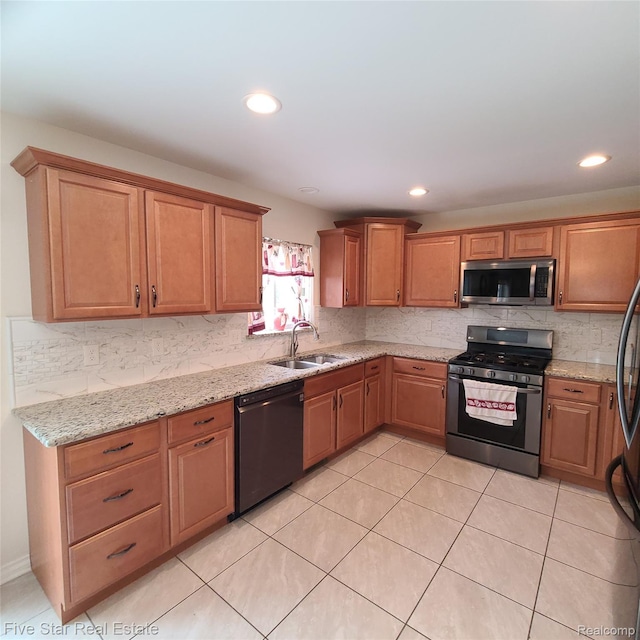 105 Degurse Ave, Marine City, MI 48039 - kitchen featuring stainless steel appliances, tasteful backsplash, light stone countertops, recessed lighting, and light tile patterned floors
