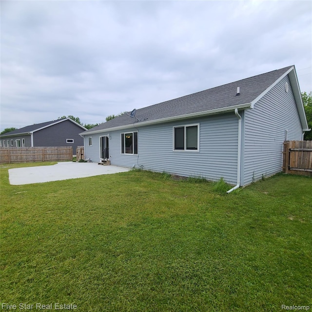 105 Degurse Ave, Marine City, MI 48039 - back of property with a patio and roof with shingles
