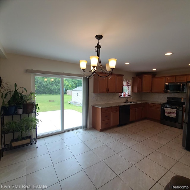 105 Degurse Ave, Marine City, MI 48039 - kitchen with gas stove, stainless steel microwave, black dishwasher, healthy amount of natural light, and recessed lighting