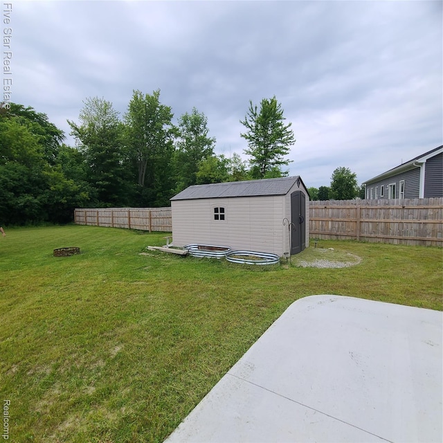 105 Degurse Ave, Marine City, MI 48039 - fenced backyard with a storage unit and a patio