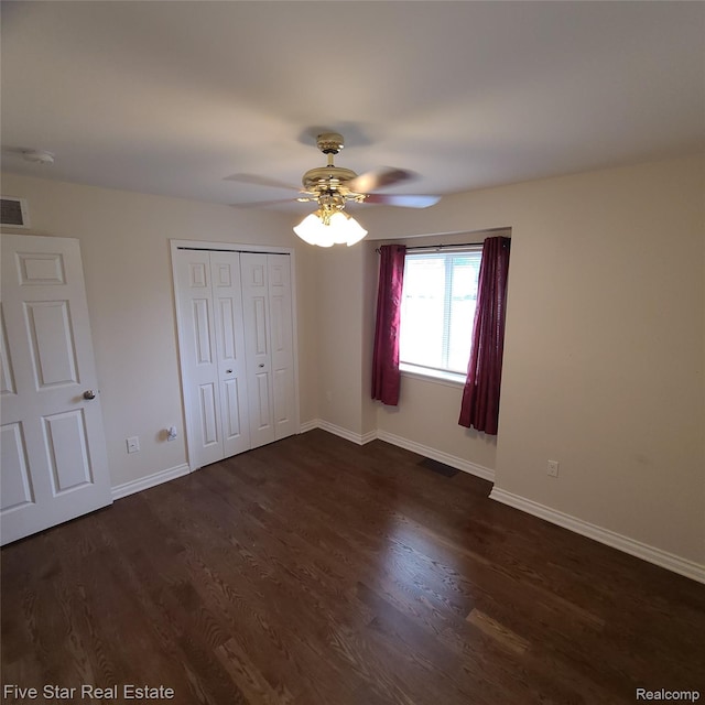 105 Degurse Ave, Marine City, MI 48039 - unfurnished bedroom featuring dark wood-style floors, a closet, and ceiling fan