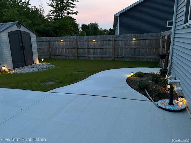 105 Degurse Ave, Marine City, MI 48039 - fenced backyard featuring a storage shed and a patio area