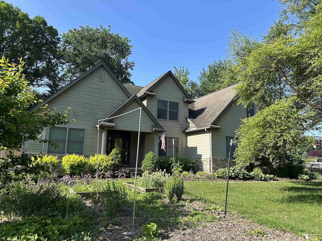 1433 Tennyson Dr, Temperance, MI 48182 - view of front facade featuring a front lawn and stone siding