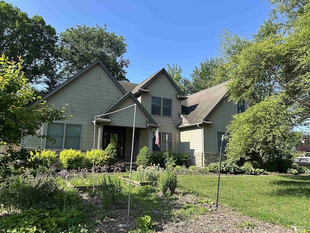 1433 Tennyson Dr, Temperance, MI 48182 - view of front facade featuring a front lawn and stone siding