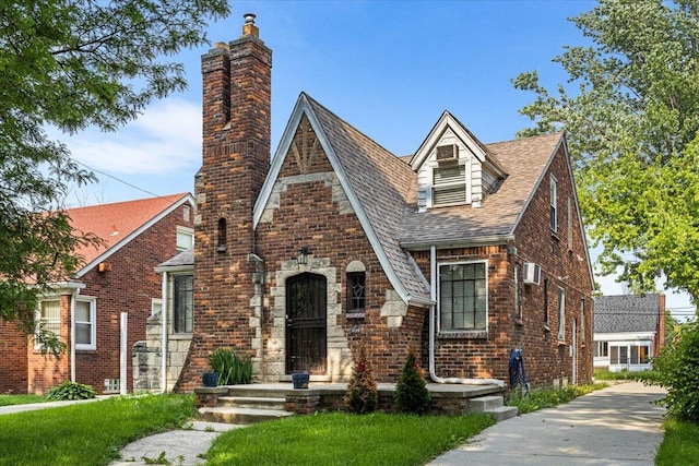 8304 Pinehurst St, Detroit, MI 48204 - english style home with a chimney, brick siding, and a shingled roof