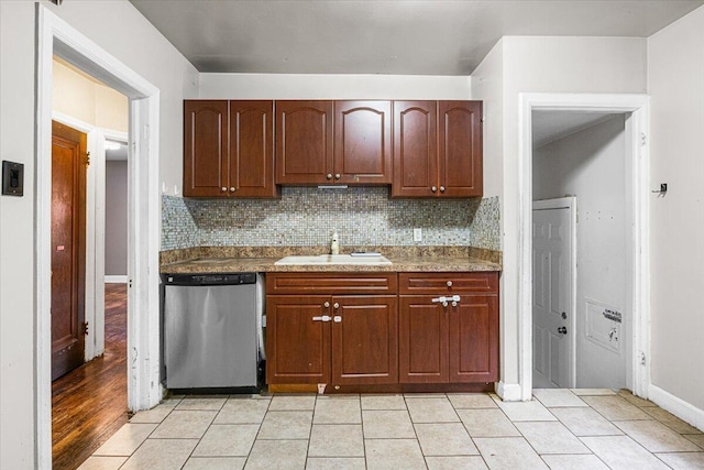 8304 Pinehurst St, Detroit, MI 48204 - kitchen featuring stainless steel dishwasher, tasteful backsplash, and light tile patterned floors