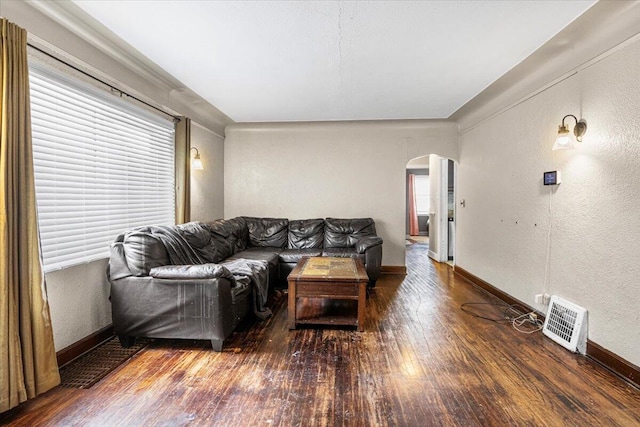 8304 Pinehurst St, Detroit, MI 48204 - living area featuring arched walkways, hardwood / wood-style floors, and a textured wall