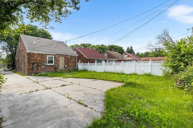 8304 Pinehurst St, Detroit, MI 48204 - rear view of house with brick siding and roof with shingles