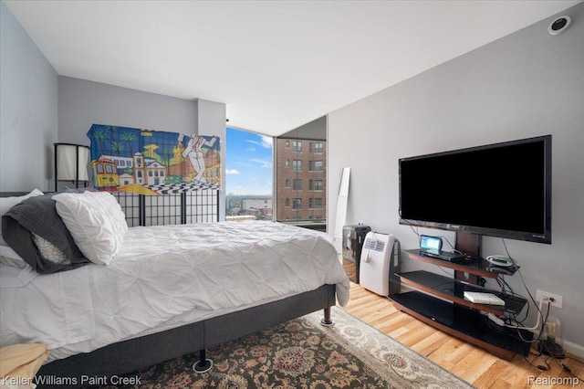 8200 E Jefferson Ave Unit 1802, Detroit, MI 48214 - bedroom featuring wood finished floors