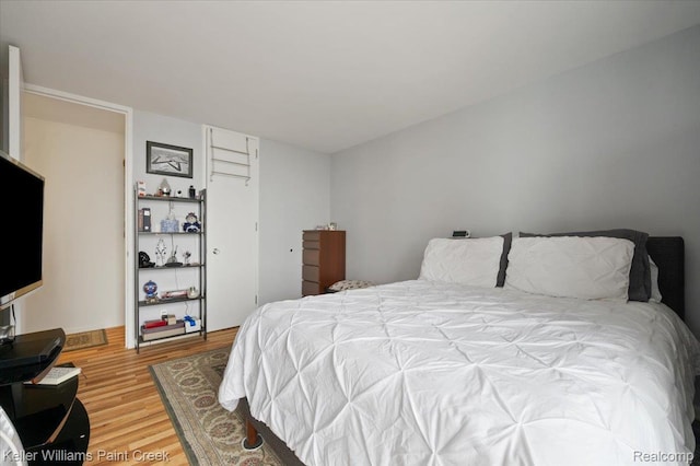 8200 E Jefferson Ave Unit 1802, Detroit, MI 48214 - bedroom featuring wood finished floors