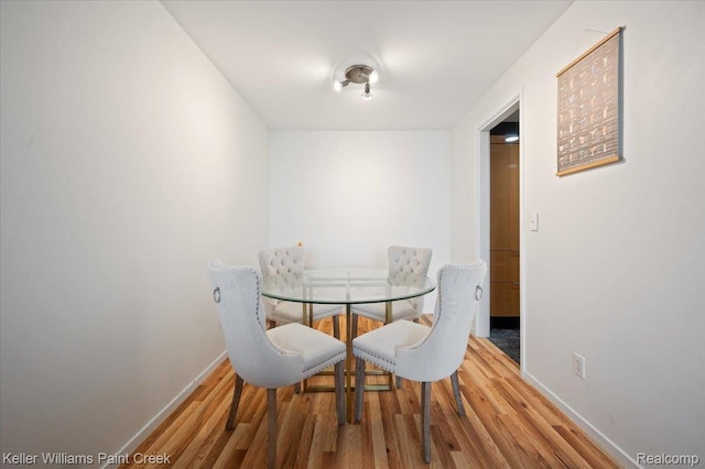 8200 E Jefferson Ave Unit 1802, Detroit, MI 48214 - dining area with wood finished floors