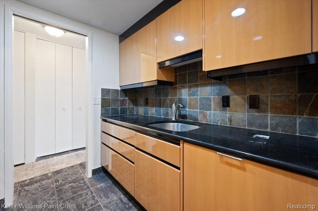8200 E Jefferson Ave Unit 1802, Detroit, MI 48214 - kitchen with decorative backsplash, dark stone counters, and under cabinet range hood