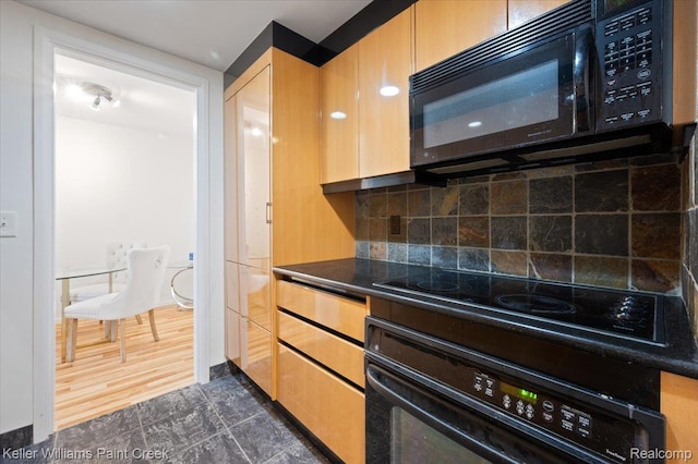 8200 E Jefferson Ave Unit 1802, Detroit, MI 48214 - kitchen featuring black appliances, dark countertops, and backsplash