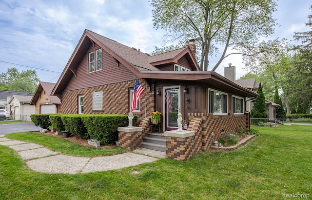 284 W Clarkston Rd, Lake Orion, MI 48362 - bungalow-style house featuring a chimney, brick siding, and a garage