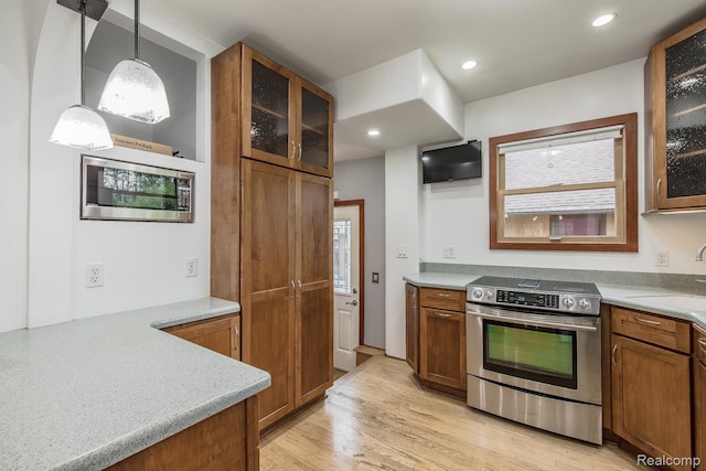 284 W Clarkston Rd, Lake Orion, MI 48362 - kitchen featuring appliances with stainless steel finishes, brown cabinets, light countertops, and recessed lighting