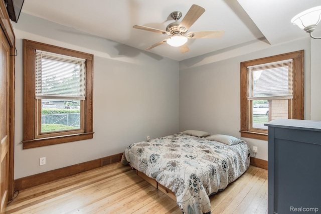 284 W Clarkston Rd, Lake Orion, MI 48362 - bedroom featuring multiple windows, light wood-style floors, and a ceiling fan