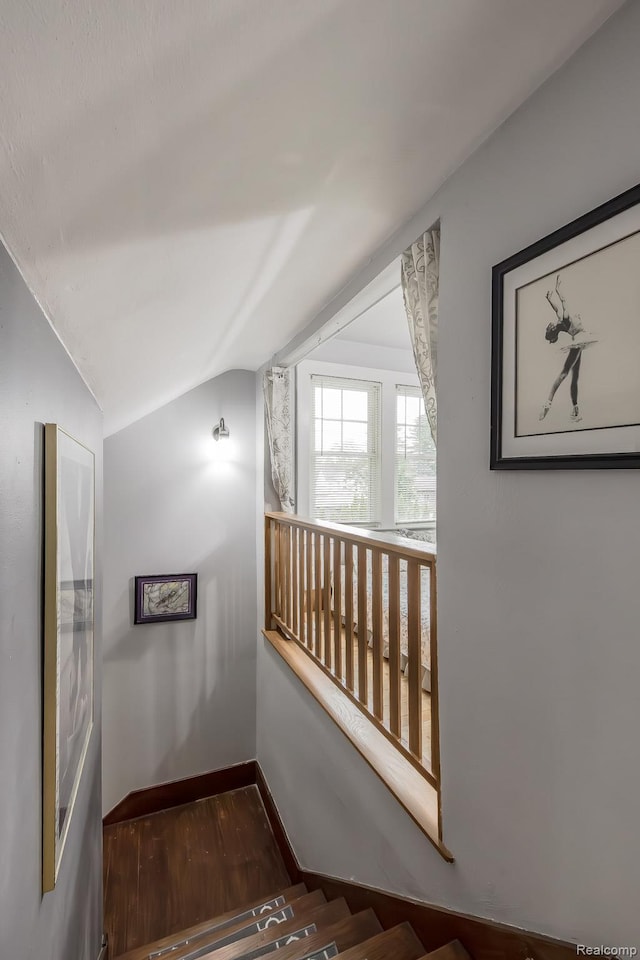 284 W Clarkston Rd, Lake Orion, MI 48362 - corridor featuring vaulted ceiling and wood finished floors