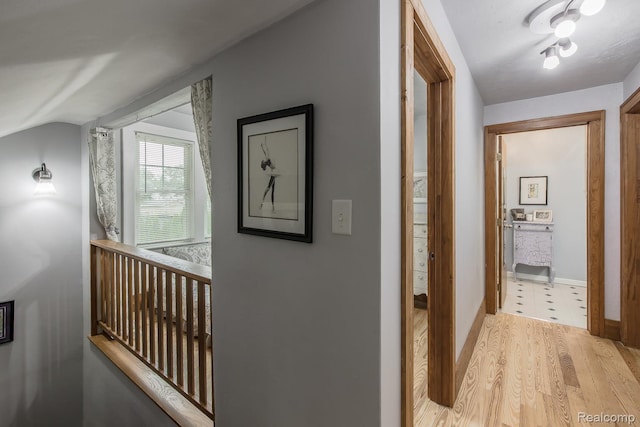 284 W Clarkston Rd, Lake Orion, MI 48362 - hall featuring light wood-style flooring and lofted ceiling