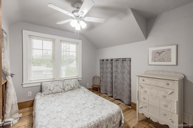 284 W Clarkston Rd, Lake Orion, MI 48362 - bedroom with vaulted ceiling, ceiling fan, and light wood-type flooring