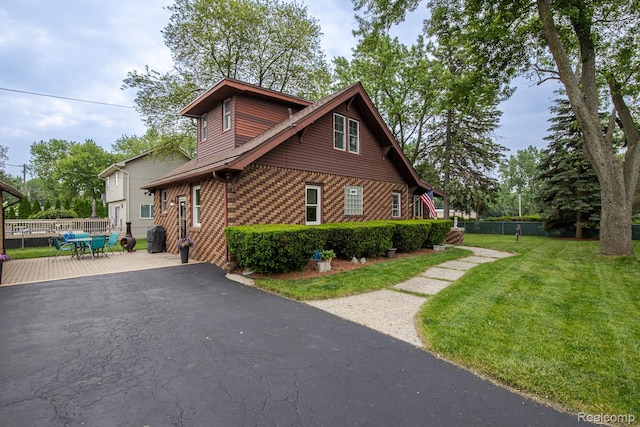 284 W Clarkston Rd, Lake Orion, MI 48362 - view of front of house featuring driveway and brick siding