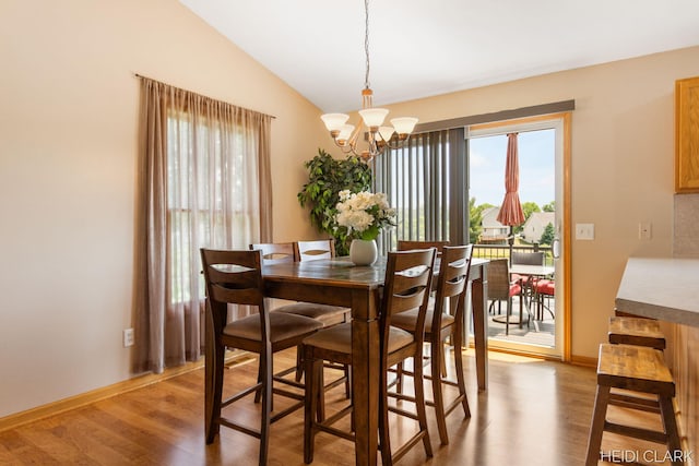 2973 Riley Ridge Rd, Holland, MI 49424 - dining space with light wood-style flooring, a chandelier, and lofted ceiling