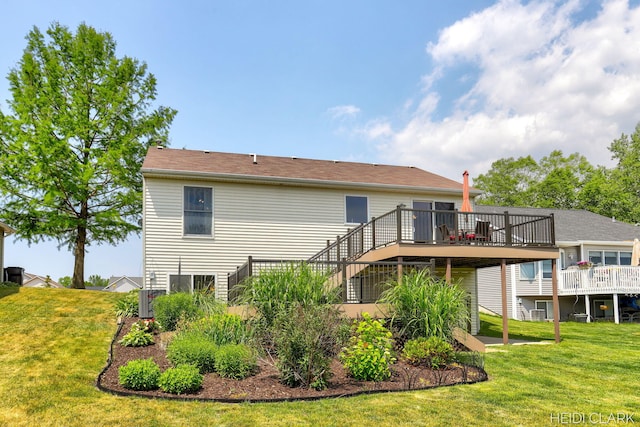2973 Riley Ridge Rd, Holland, MI 49424 - back of house with a wooden deck, a lawn, and stairs
