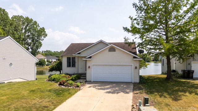 2973 Riley Ridge Rd, Holland, MI 49424 - traditional home with a water view, concrete driveway, a front lawn, and roof with shingles