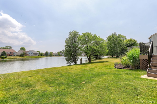 2973 Riley Ridge Rd, Holland, MI 49424 - view of green lawn with a deck with water view and stairs