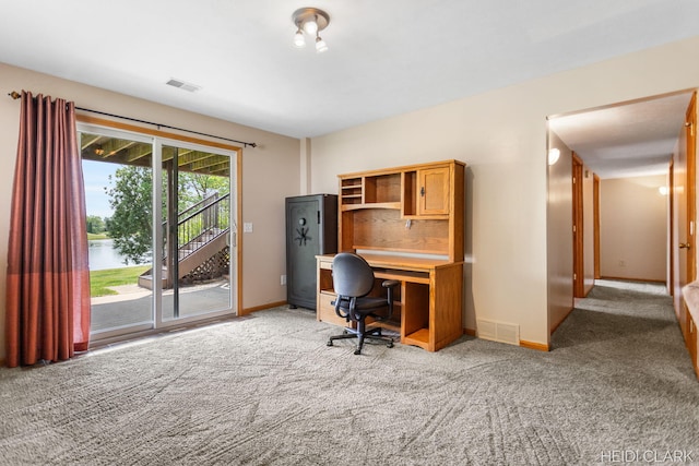 2973 Riley Ridge Rd, Holland, MI 49424 - carpeted home office featuring a water view and baseboards