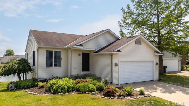 2973 Riley Ridge Rd, Holland, MI 49424 - ranch-style home featuring roof with shingles, an attached garage, a front yard, and concrete driveway