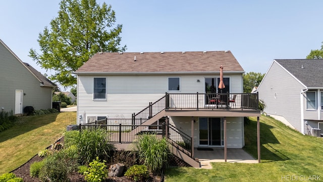 2973 Riley Ridge Rd, Holland, MI 49424 - back of house with stairway, a deck, a patio area, and a lawn