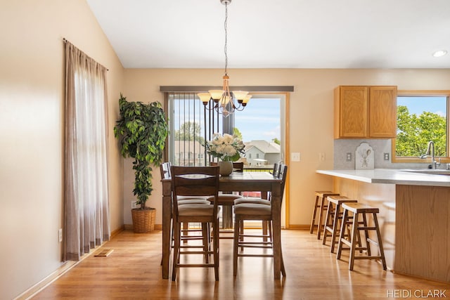 2973 Riley Ridge Rd, Holland, MI 49424 - dining area with light wood finished floors, a chandelier, healthy amount of natural light, and recessed lighting