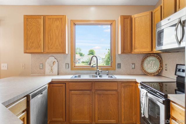 2973 Riley Ridge Rd, Holland, MI 49424 - kitchen featuring stainless steel appliances, backsplash, and light countertops