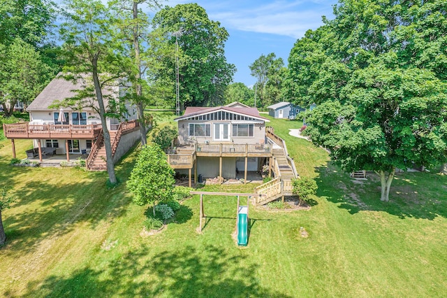 2759 Hemlock Rd, Quincy, MI 49082 - back of property with stairway, a wooden deck, and a yard