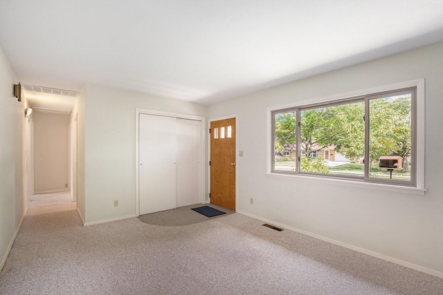 522 Lyon St, South Haven, MI 49090 - unfurnished bedroom featuring carpet and a closet