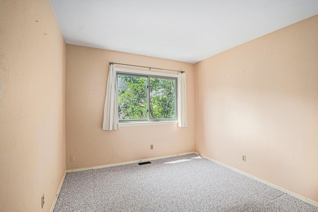 522 Lyon St, South Haven, MI 49090 - carpeted empty room with baseboards